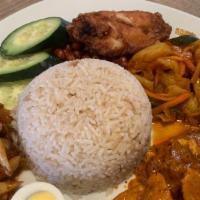 Nasi Lemak · Coconut flavoured rice with peanuts, chicken wings, hard boiled egg, curry chicken acar, oni...