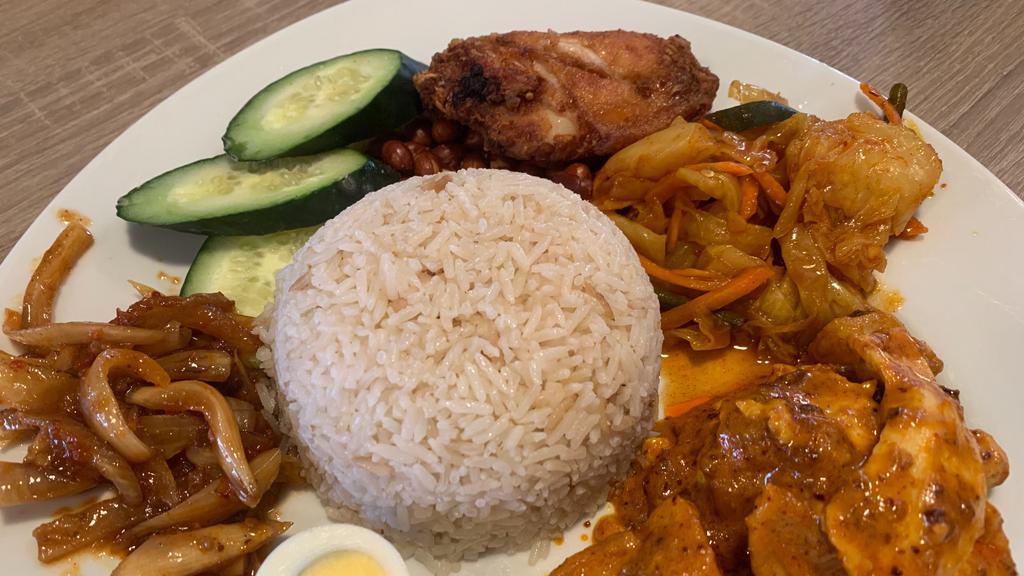 Nasi Lemak · Coconut flavoured rice with peanuts, chicken wings, hard boiled egg, curry chicken acar, onion and home special chili paste.