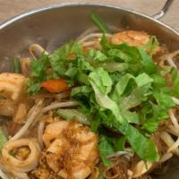 Seafood Rice Noodles · Stir fried thin rice noodles with shrimps, squids, egg and vegetables.