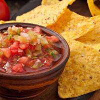 Chips and Salsa · Basket of chips served with salsa.