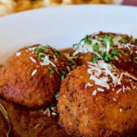 Arancini Balls Stuffed with Bolognese and Romano · Risotto balls stuffed with ground beef, tomato sauce, and romano cheese served with pesto ma...