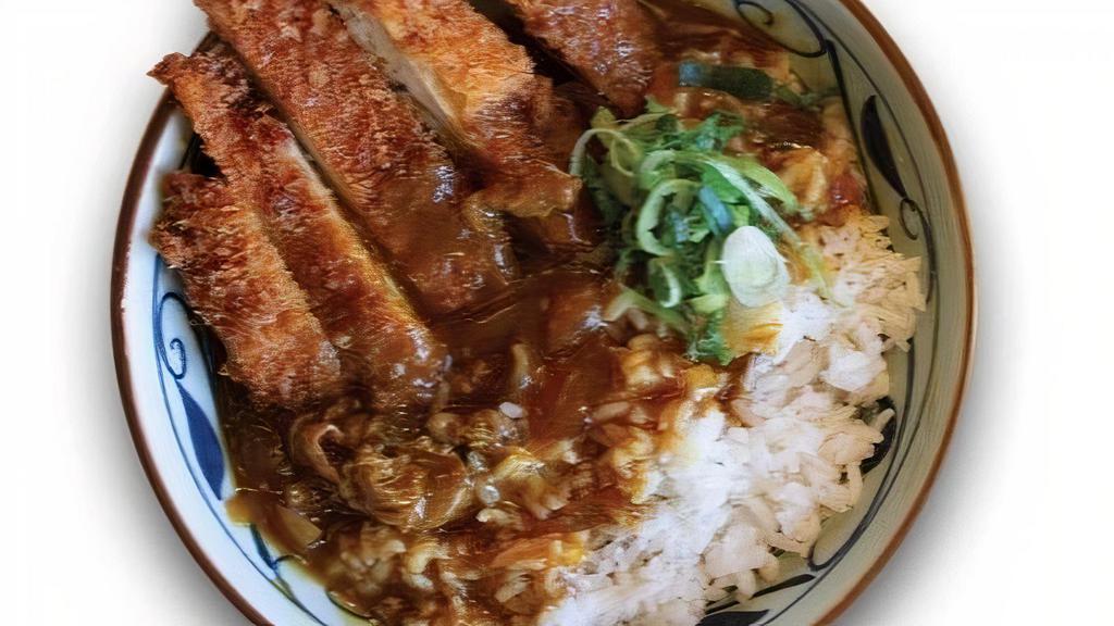 Chicken Katsu Curry · Our traditional Japanese curry served over white rice and topped with a crispy chicken katsu