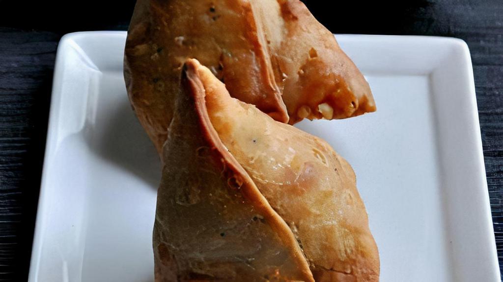 Samosa · Fried homemade street-food style pastry with savory filling such as potatoes, peas, lentils and spices