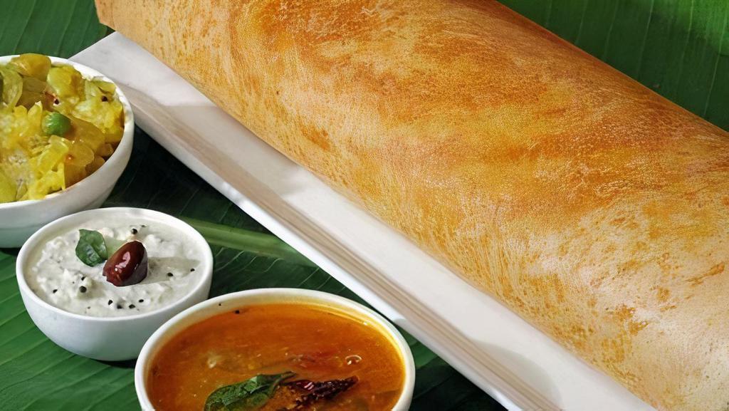Gongura Dosa · Two street-style dosas generously topped with Tangy Gongura to pinch your taste buds. Served with Sambar and Chutneys.