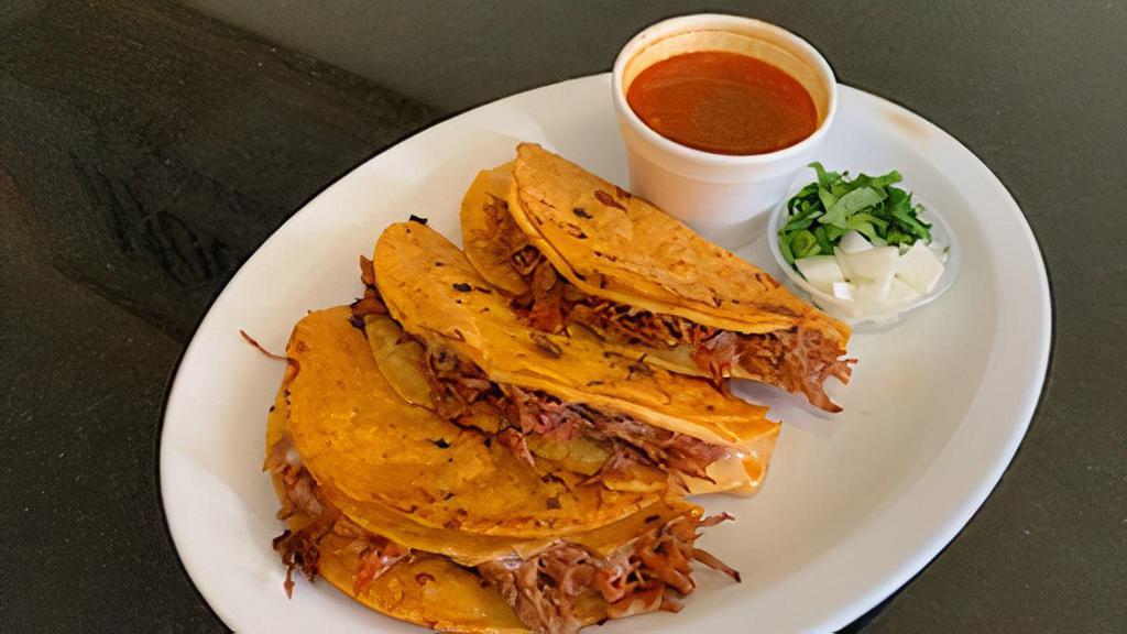 Quesabirria Taco · Corn tortilla stuffed with cheese, birria beef ,cilantro. Consome included on side!