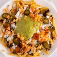 Nacho Fries · Fries covered with choice of meat, cheese, sour cream, tomatoes, guacamole and jalapenos.