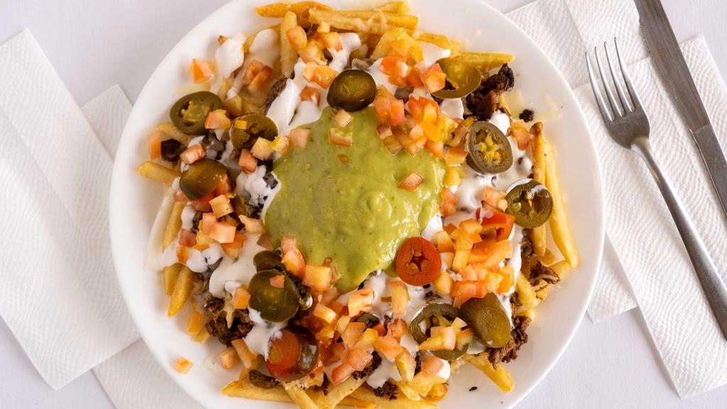 Nacho Fries · Fries covered with choice of meat, cheese, sour cream, tomatoes, guacamole and jalapenos.