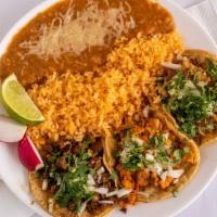 Taco Plate · Three regular tacos served with rice and beans.