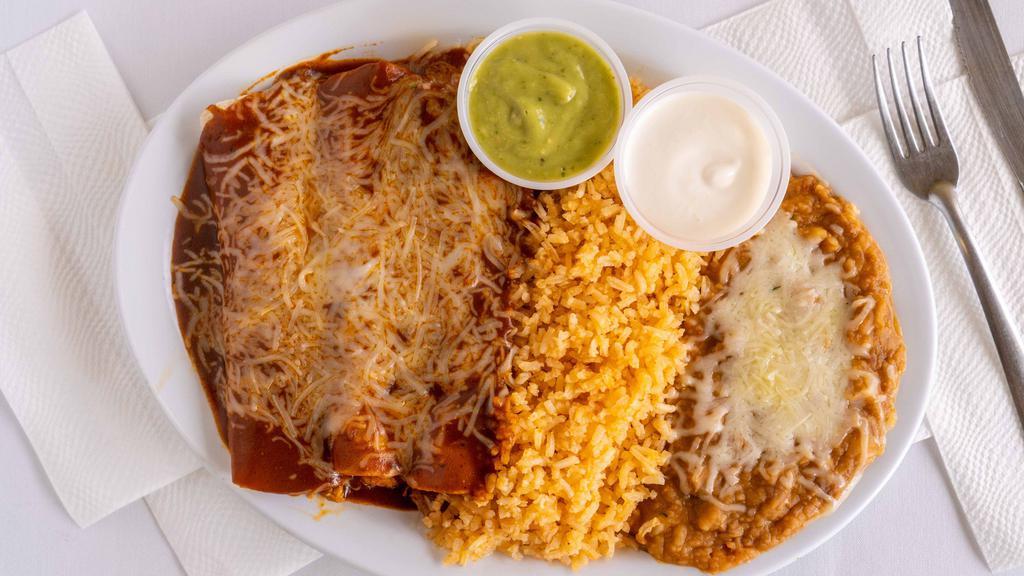 Enchilada Plate · Three enchiladas served with rice, beans, sour cream and guacamole.