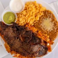 Chilaquiles with Steak · Steak served with salsa, rice, beans, egg, sour cream and guacamole.