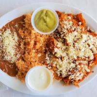 Chilaquiles · Rice, beans, egg, sour cream and guacamole.