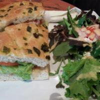 Tuna Melt Sandwich · Tuna salad, with capers, onion, bell pepper, tomato, lettuce, mayo, and Swiss.