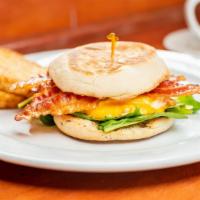 Two Eggs Any Style · Served with English muffin and choice of fruit or hash browns.