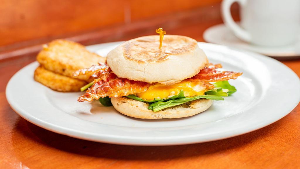 Two Eggs Any Style · Served with English muffin and choice of fruit or hash browns.