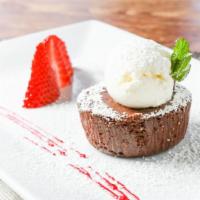 Flourless Chocolate Cake · Sweet mascarpone, berry sauce.