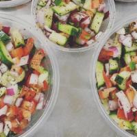 Shirazi Salad · Persian cucumbers, red onions, tomatoes tossed with dry dill or mint topped with lemon wedge.