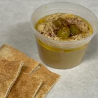 Hummus and Pita · Homemade hummus, made from cook chickpea blended with tahini, lemon juice and garlic. Top wi...