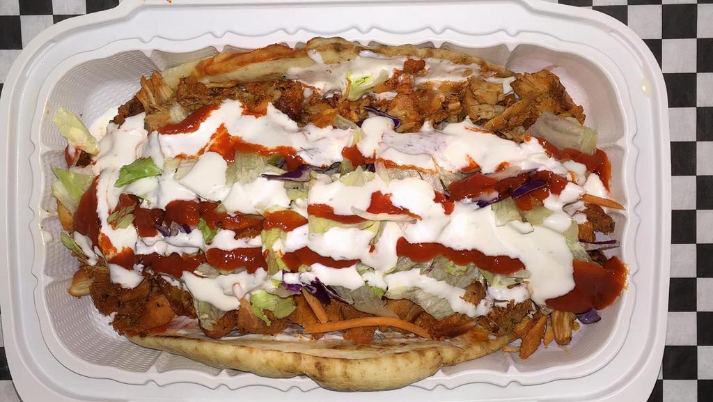 Lamb Gyro · Juicy grilled lamb gyro wrapped in a pita bread topped with onions, tomatoes, lettuce and tzatziki.
