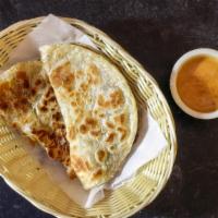 Roti Panang Curry ( Vegetarian) · Pan-fried puff Paratha with a side of green curry sauce.