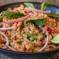 Larb Salad · Ground meat tossed with chilli powder, cilantro, mint ,red onion , rice powder & lime Juice.