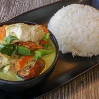 Green Curry · Coconut milk green curry with bells, carrot, peas, eggplant & basil.