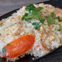 Fried Rice · Jasmine rice, egg, yellow-green onions & tomatoes.