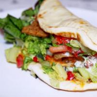 Gyro · Spit-roasted beef & lamb, sliced & served in a pita with tzatziki, onions & tomatoes.