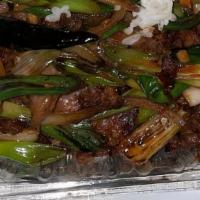 Mongolian Beef · Spicy. Beef sautéed with chili peppers and green & white onion in our special hot sauce, ser...