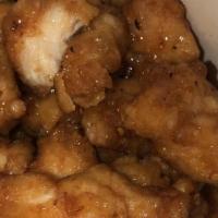 Orange Chicken · Tossed with chili peppers and orange peels for a combination of spice and citrus