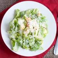 Caesar Salad · Romaine lettuce, homemade croutons, caesar dressing and shaved parmesan cheese.