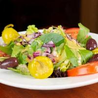 Insalata Misto · Mixed green salad with spring mix, romaine, roma tomatoes, kalamata olives and red onions. C...