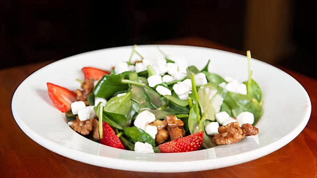 Spinach Salad · Spinach, Strawberries, goat cheese, walnuts with balsamic dressing on the side.
