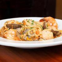 Pescatore Linguini · Linguini with scallops, prawns and clams with a white wine, butter, garlic sauce. Red with a...