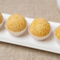 ST5. Fried Sesame Ball with Lotus Paste (4) · Classic deep fried sesame ball filled with sweet lotus paste.