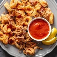 Fried Calamari · Classic recipe with tartar sauce, cocktail sauce and fries.