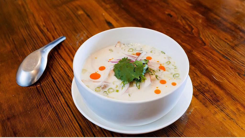 Tom Kha · Vegetarian option. Lemongrass, kaffir lime leaves, cilantro, oyster mushrooms, green onions, and red onions in a coconut milk broth.