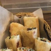 Crispy Rolls · Vegetarian option. Glass noodles, carrots, cabbage, and wood ear mushrooms. Served with swee...