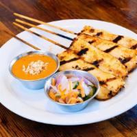 Chicken Satay · On skewers and turmeric coconut milk. served with peanut curry sauce and cucumber relish.