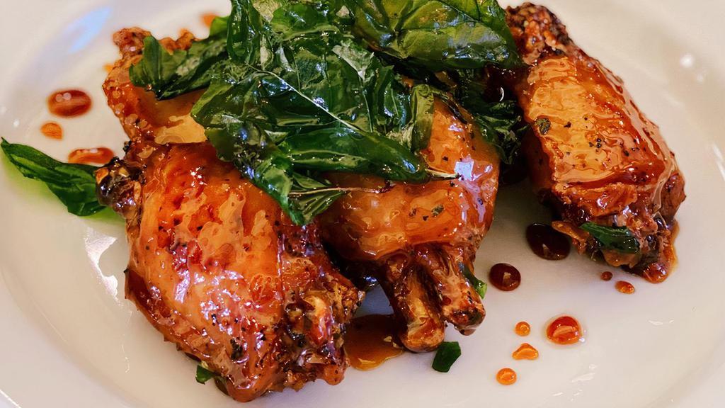 Chicken Wings · Crispy chicken wings. Served with spicy tangy house sauce and crispy sweet basil.