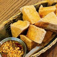 Fried Tofu · Vegetarian option. Served with sweet, sour sauce, and ground peanuts.