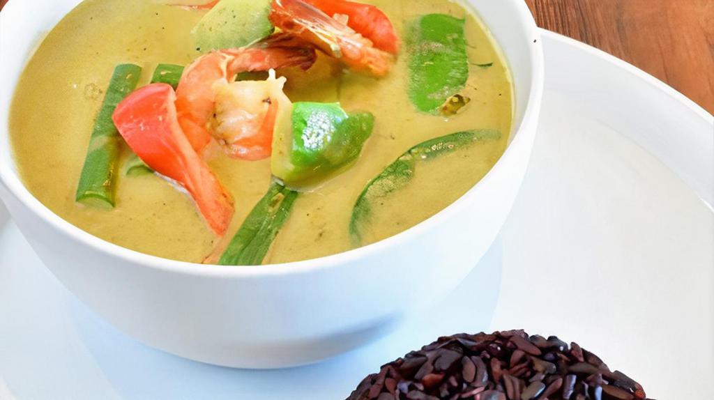 Avocado Green Curry · Medium spicy. Green coconut milk curries with avocados, green beans, bell peppers, and sweet basil. Served with rice.