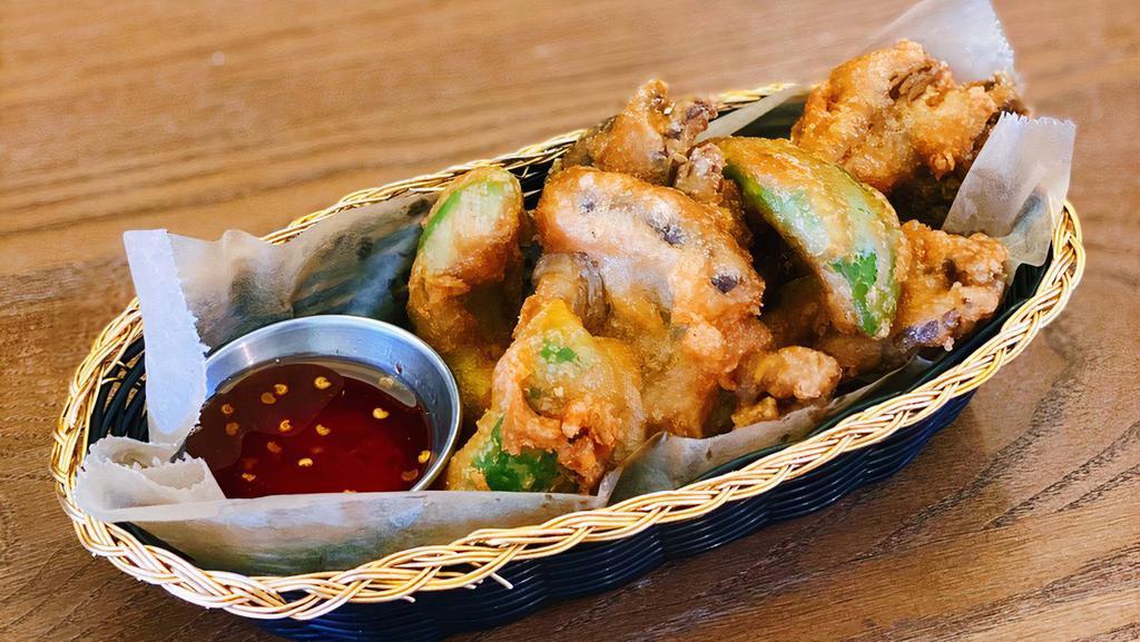Fried Oyster Mushroom and Avocado · Vegetarian option. Lightly battered fried oyster mushrooms and avocado. Served with sweet and sour sauce.