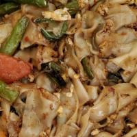 Pad Kee Mao · Vegetarian option. Medium spicy. Flat rice noodles, eggs, green beans, bell peppers, tomatoe...