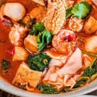 Yen Ta Foh · Vegetarian option. Medium spicy. Flat rice noodles, calamari, shrimps, fish ball, tofu, cris...