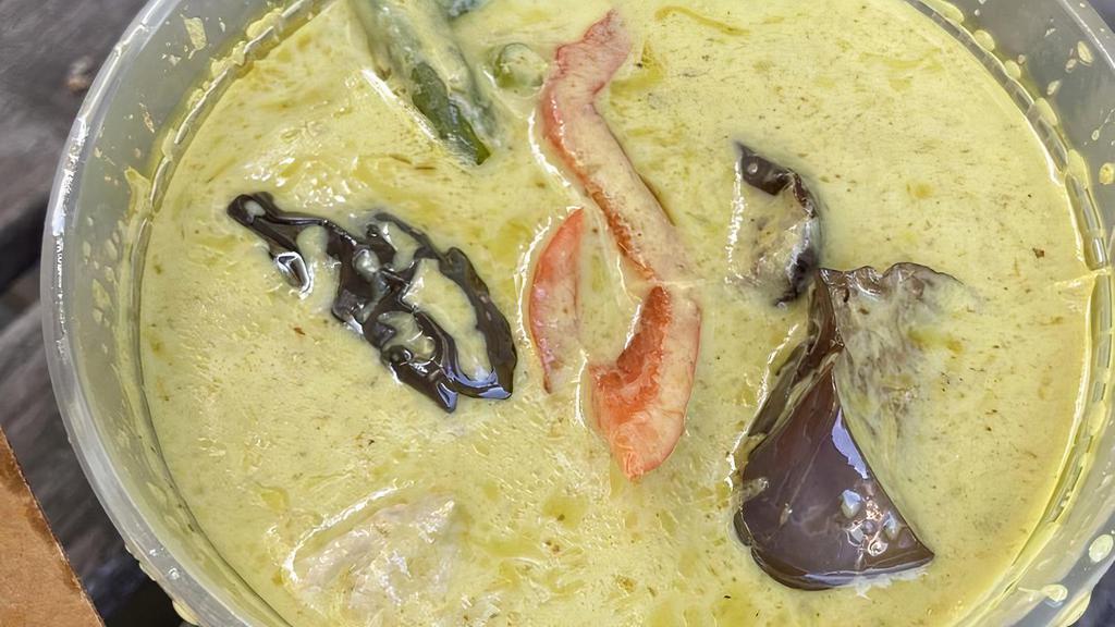 Green Curry · Medium spicy. Green coconut milk curry with green beans, eggplant, bell peppers, and sweet basil.
