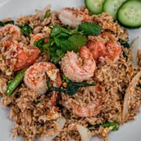 Thai Fried Rice · Vegetarian option. Egg, onions, tomatoes, and Chinese broccoli served with fresh cucumber.
