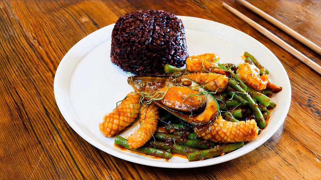 Green Beans · Vegetarian option. Mild spicy. Stir fried green beans with chili paste, garlic, and kaffir lime leaves.