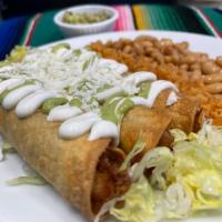 Flautas · One rolled up chicken crunchy tacos with a bed of lettuce, topped with sour cream, queso fre...