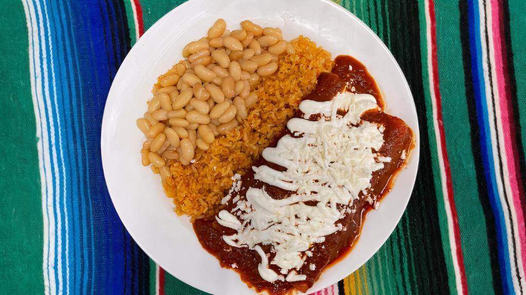Enchiladas Plate · Three enchiladas with your choice meat, sauce (green or red) topped with sour cream and quest fresco.