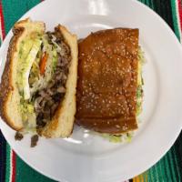 Torta · Toasted bread with choice of meat, guacamole, lettuce, tomato, onions, jalapeños, mayo, and ...